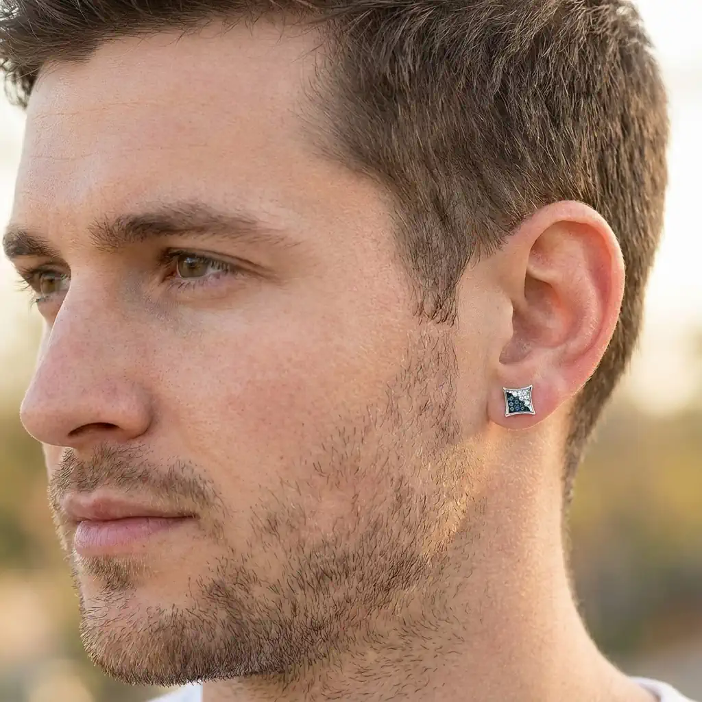Man wearing kite shape hip hop diamond stud earring with blue and white diamonds