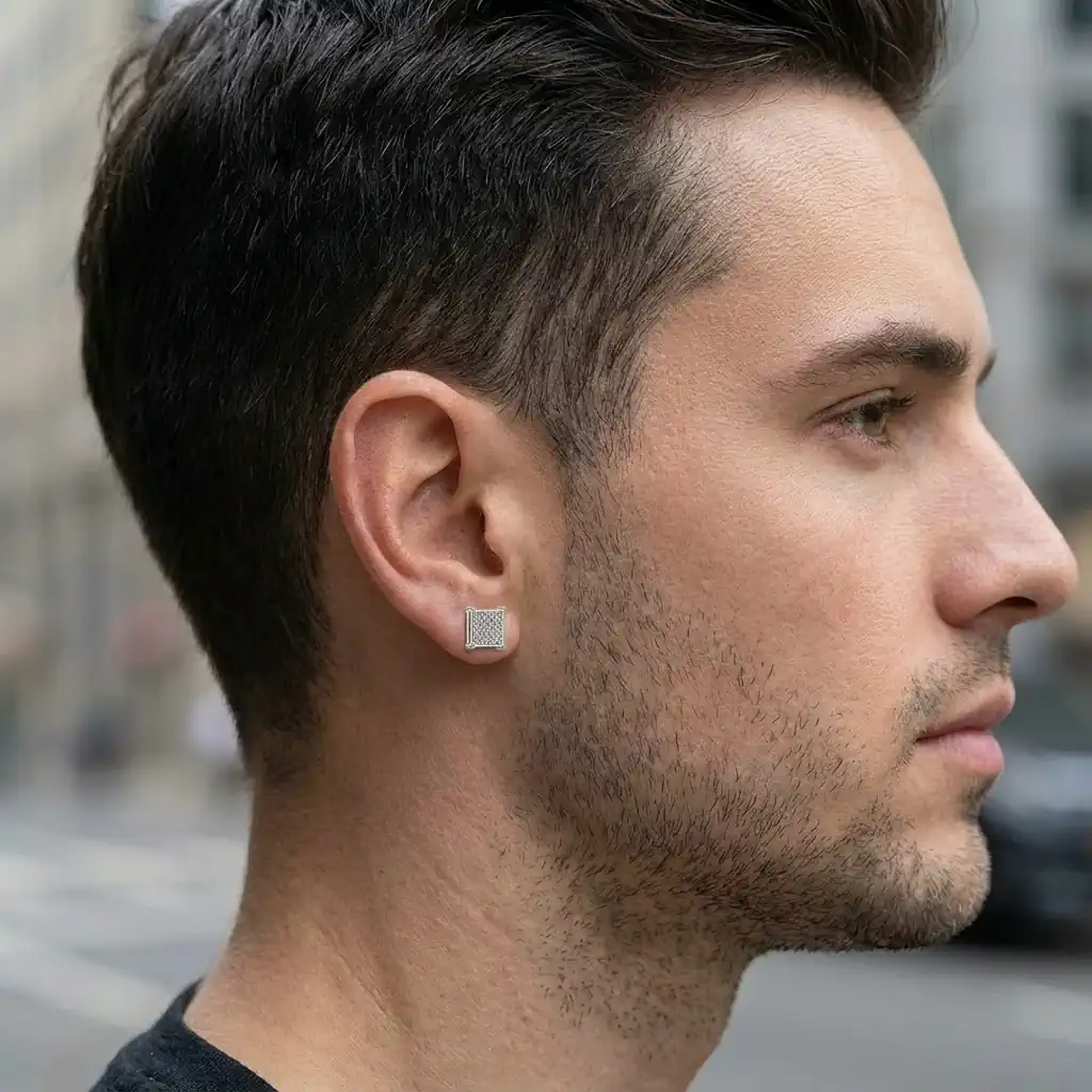 Man wearing 8mm square white diamond stud earring in sterling silver