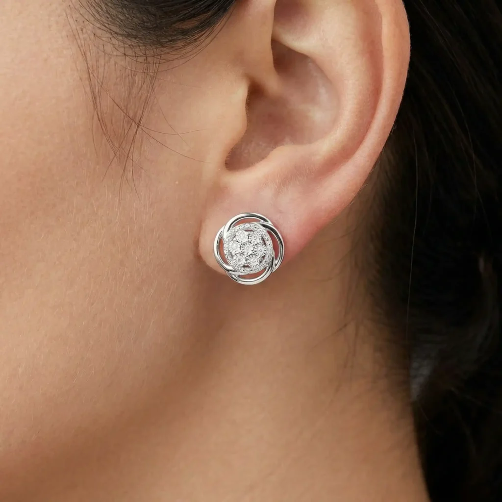 woman wearing round white diamond swirl flower stud earrings