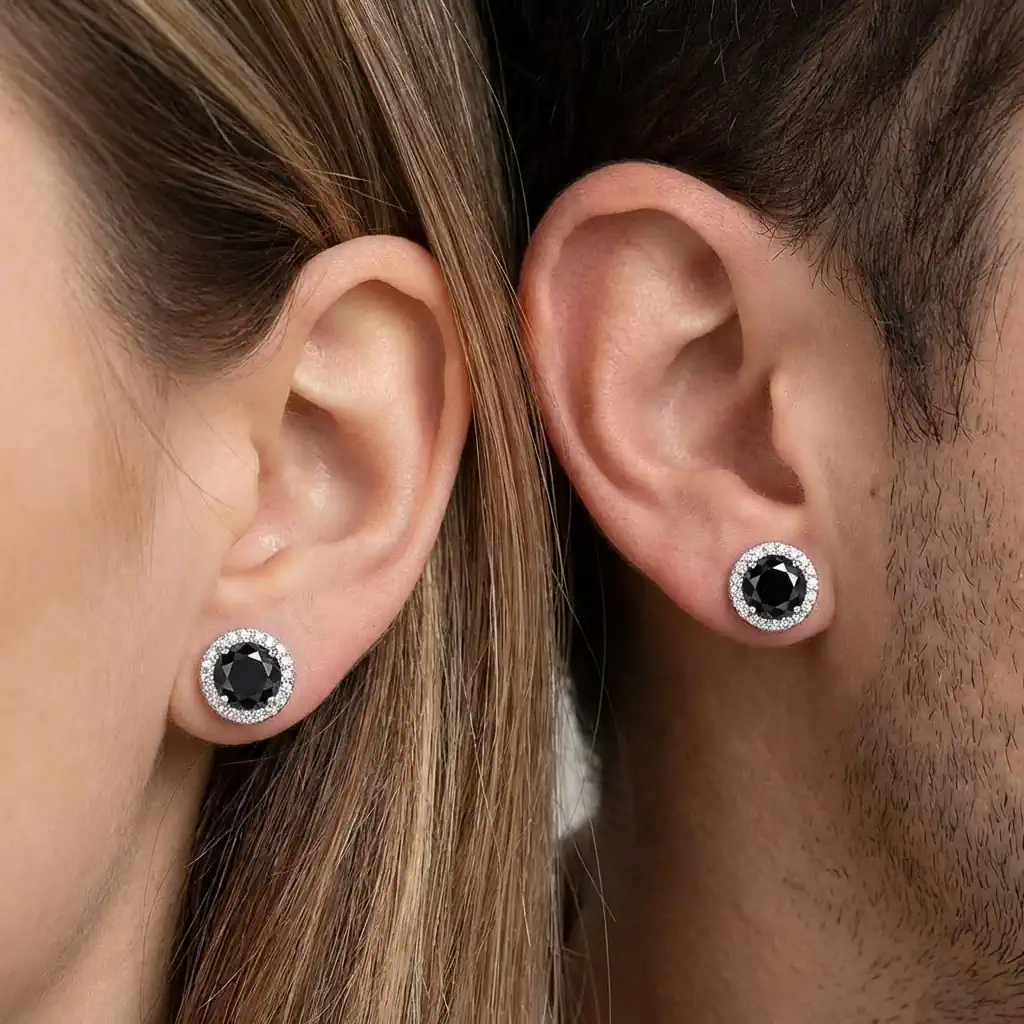 Man and woman wearing round halo moissanite stud earrings in white gold plated sterling silver